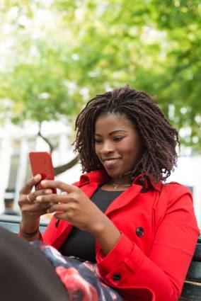african woman using smartphone